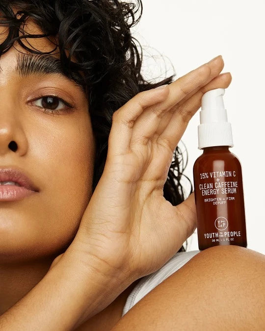 Model with 15% Vitamin C + Clean Caffeine Energy Serum